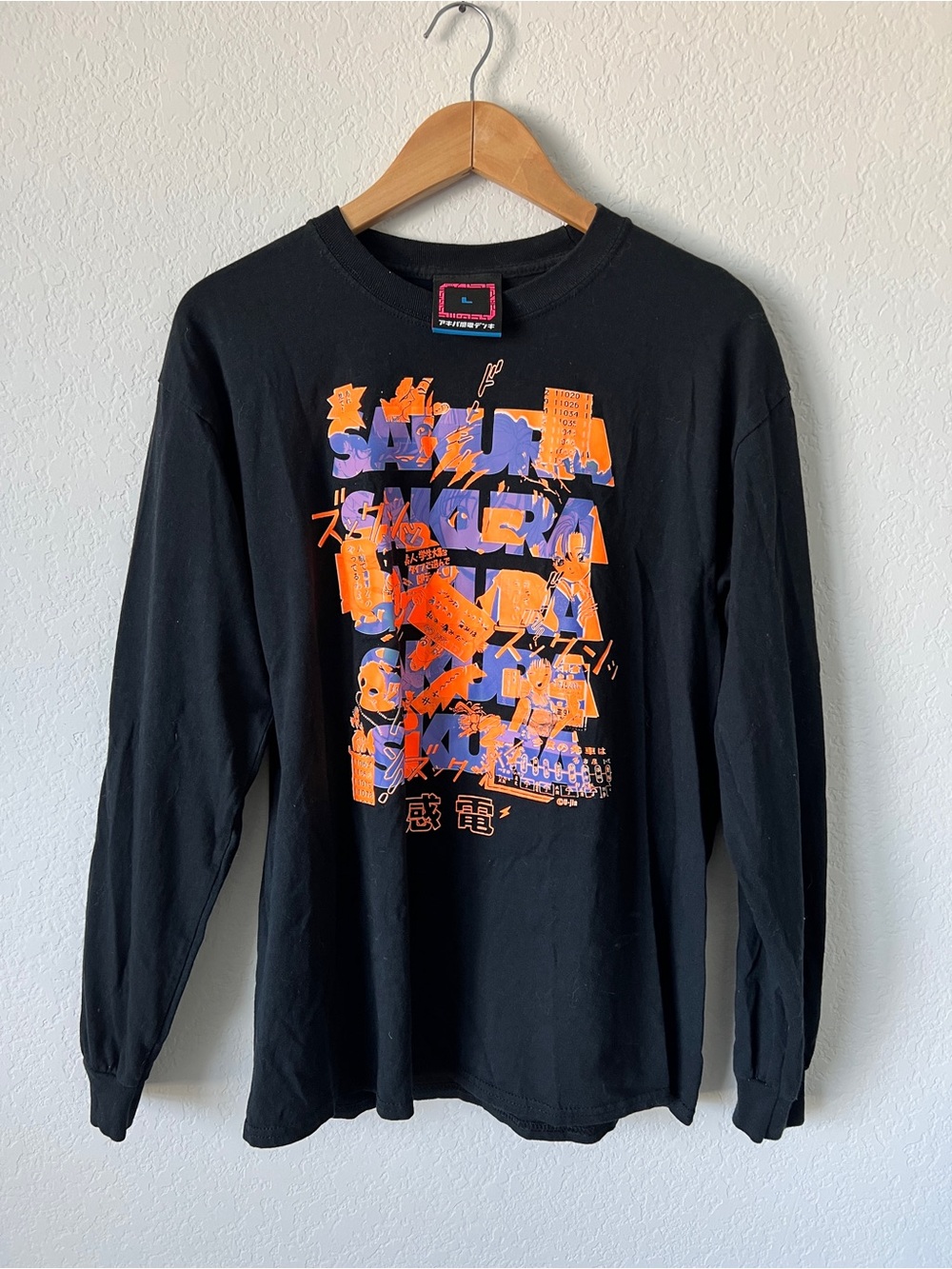 Japanese streetwear brand Long-Sleeve Graphic Tee with Orange & Purple Print